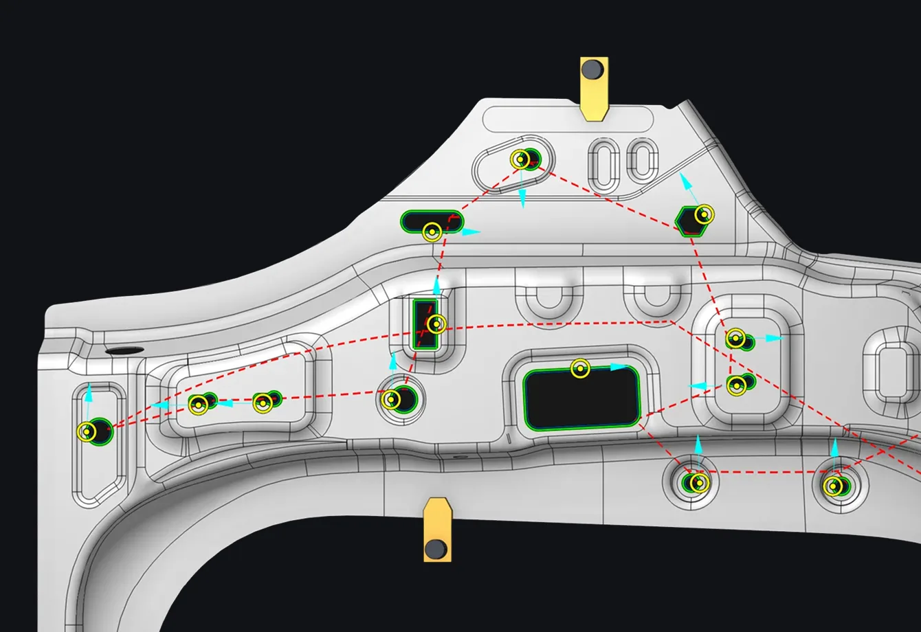Machined part with recognized holes and slots outlined in green and a dashed traverse path between them