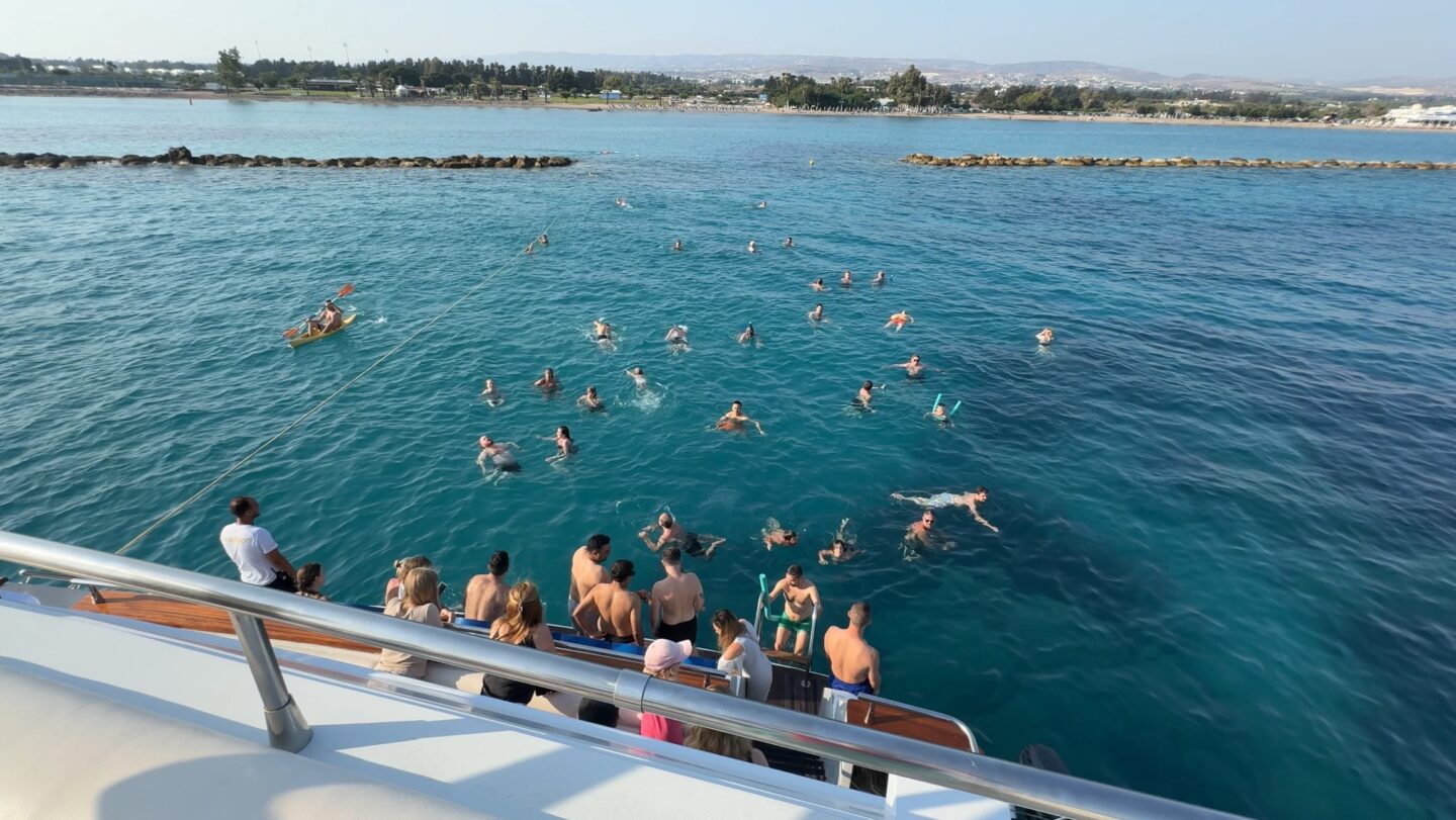 People swimming and enjoying the clear blue waters of the sea.