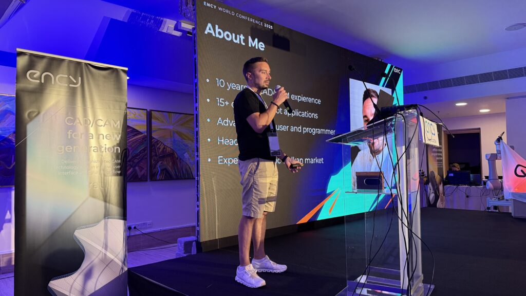 A speaker presents information about their experiences on stage.