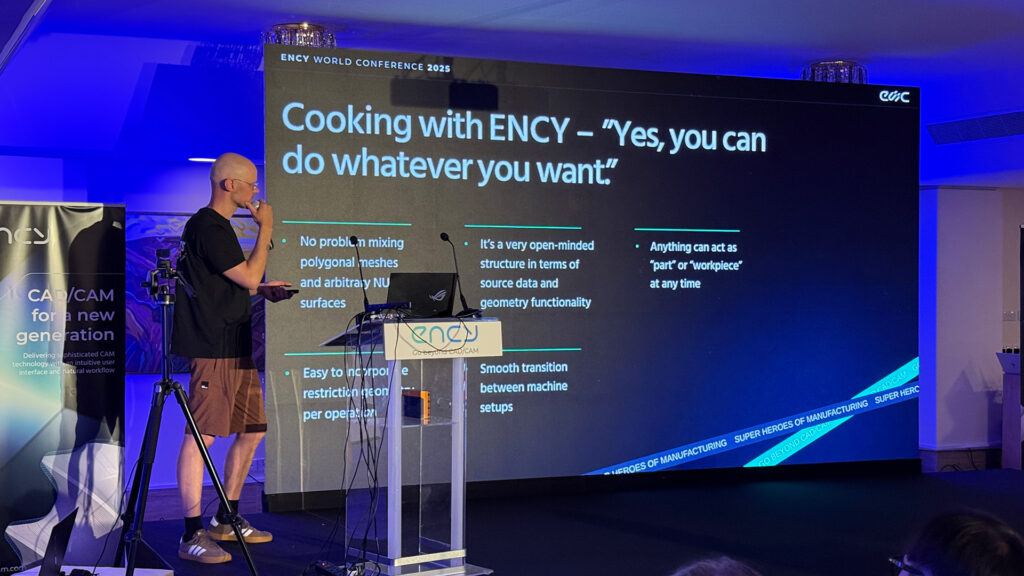 A speaker presents at a cooking demonstration featuring ENCY.
