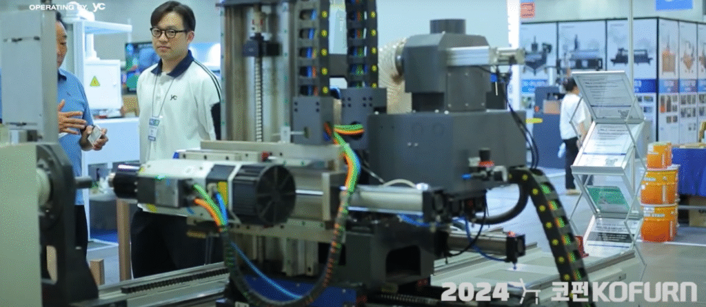 A machine setup with motors and colorful wiring is shown.
