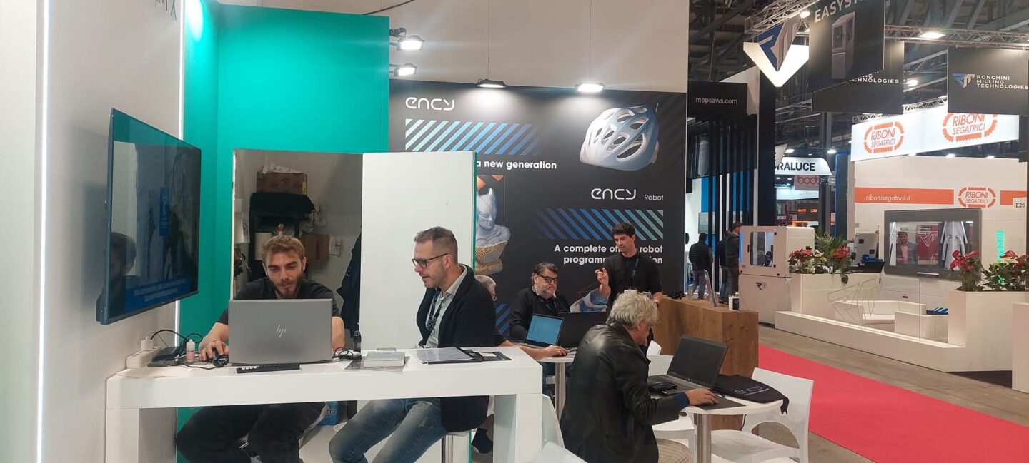 A group of people engaged in discussions at a technology exhibition.