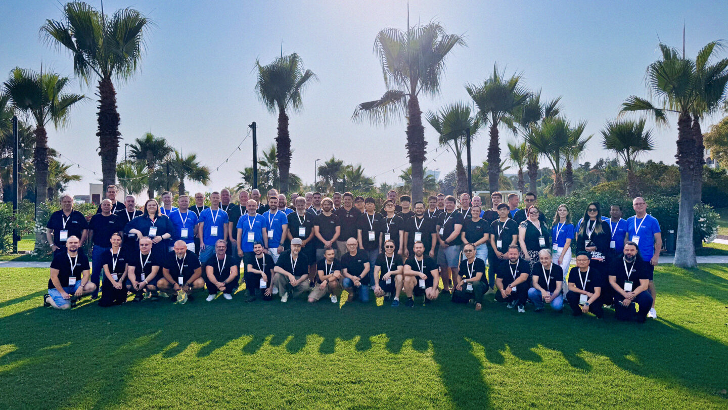 The ENCY Software team gathers for a group photo outdoors.