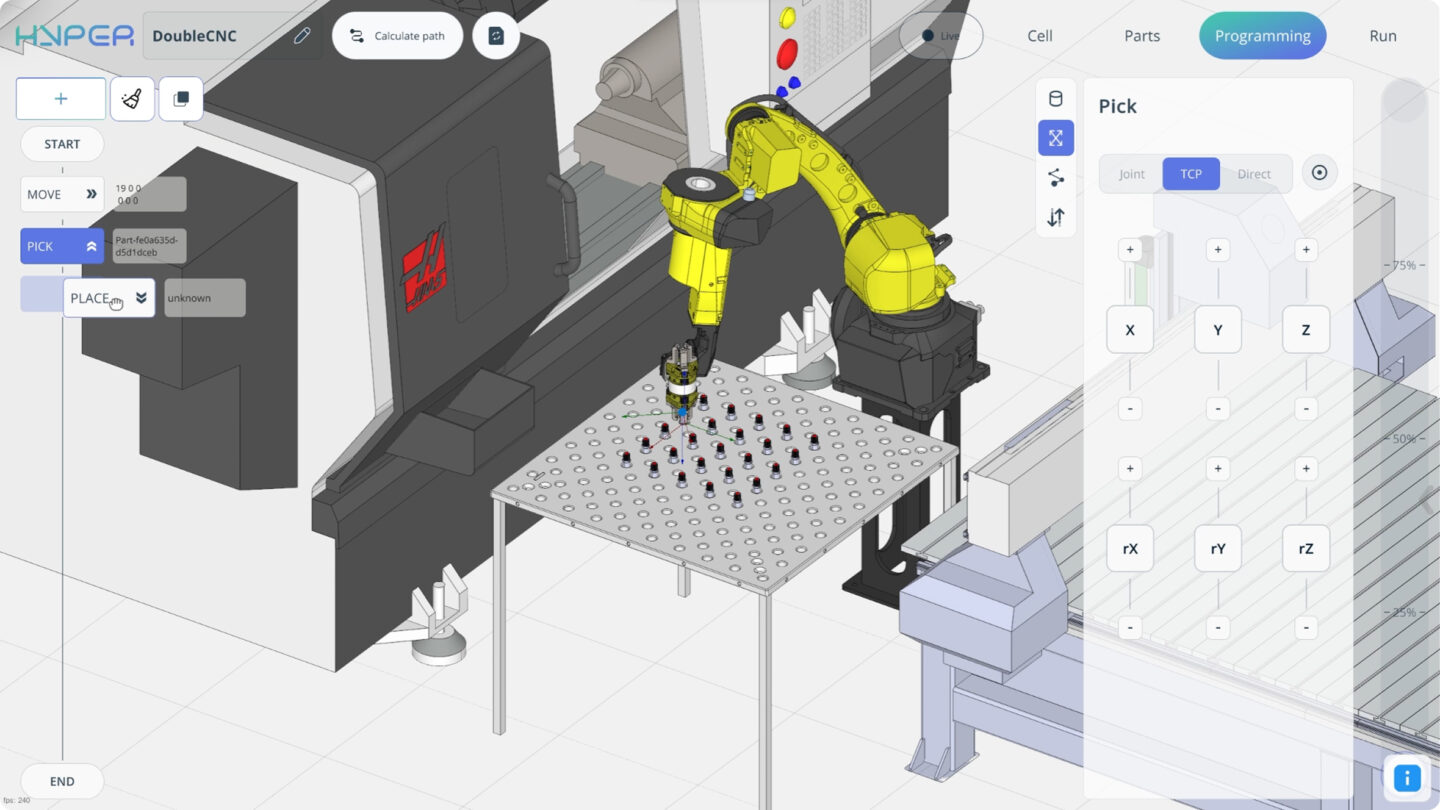 A robotic arm uses block-based programming to manipulate objects.