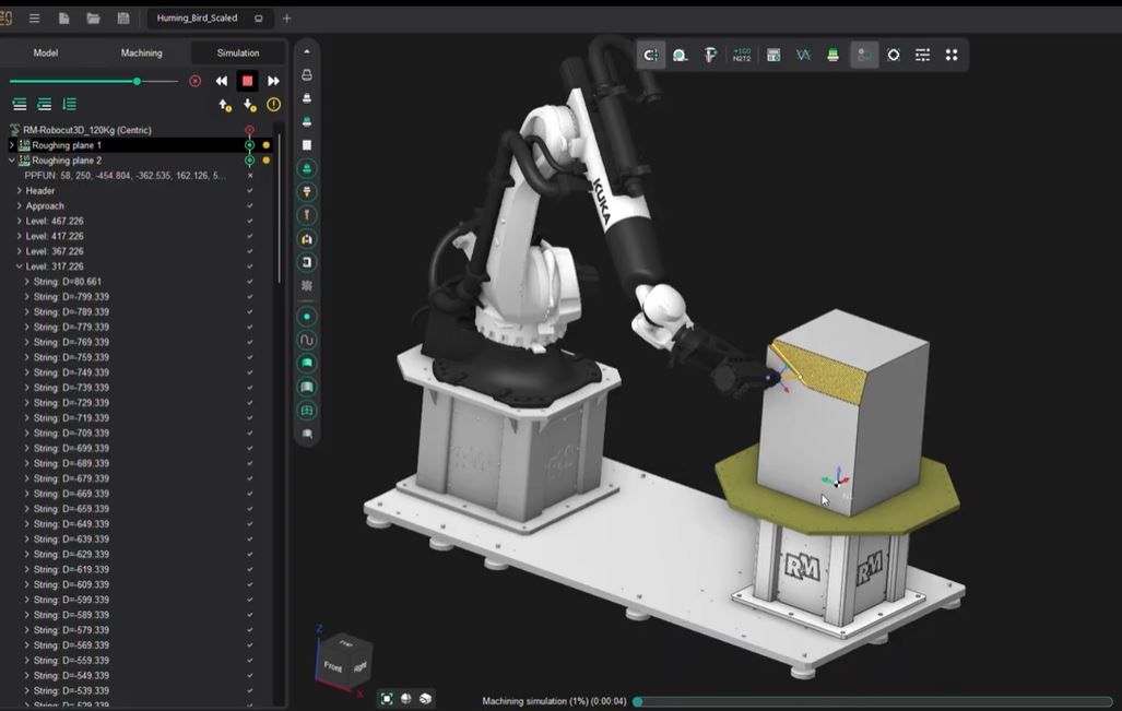 White six-axis industrial robot beside octagonal rotary table holding metal test coupons, with safety panels enclosing the cell