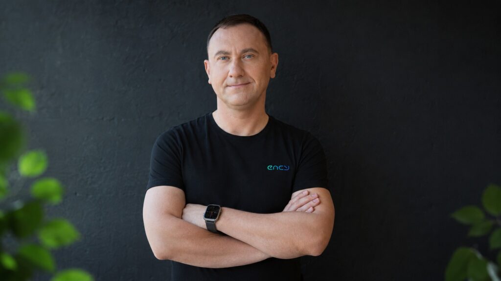 Andrew Lovygin, Channel Sales Director at ENCY Software, wearing an ENCY-branded shirt