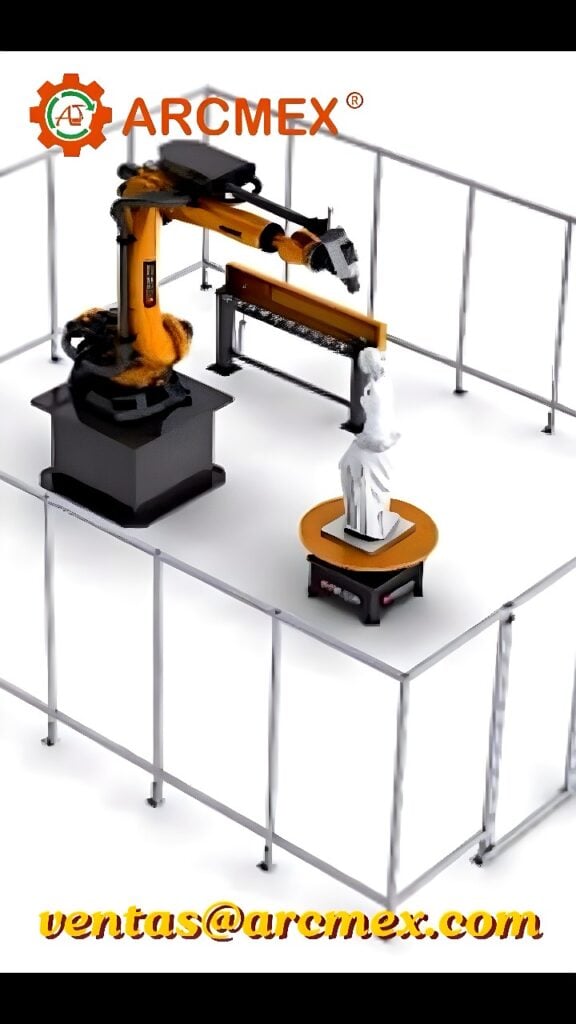 Six-axis articulated robotic arm inside a safety-fenced machining cell aligned with a motorized rotary table holding a white sculptural workpiece